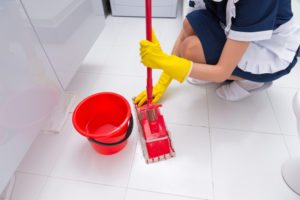 Cleaning the floor with a mop