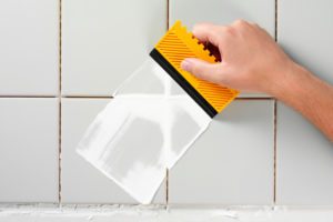 Tilling and grouting a wall Tilling and grouting a wall